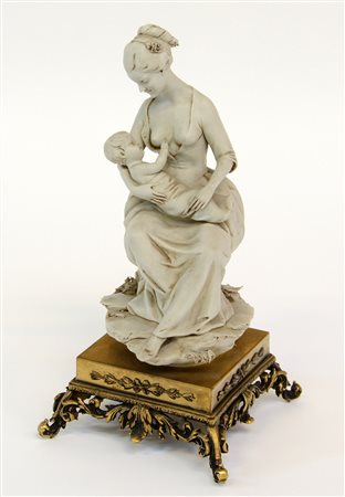 "Fanciulla con bambino in grembo" statuetta in biscuit, base in metallo...