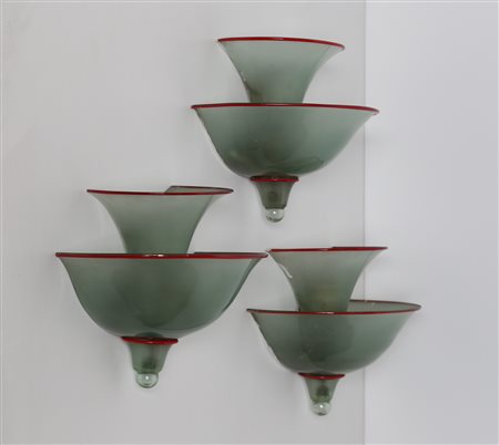MARTINUZZI NAPOLEONE (1892 - 1977) Tre appliques, in vetro grigio con bordo...