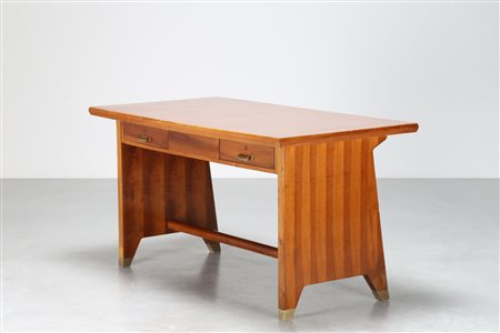 PONTI GIO' (1891 - 1979) Scrivania in noce con piano in formica, piedini e...