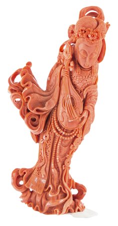 Scultura in corallo raffigurante Guanyin, Cina XIX secolo. Peso g 354....