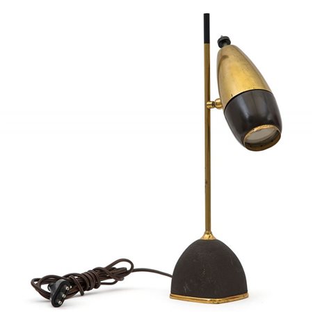 OSCAR TORLASCO Una lampada da tavolo per LUMI, circa 1960. Ghisa verniciata a...