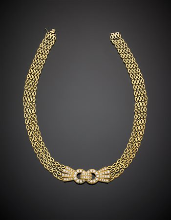 Collier in oro giallo a quattro fili modulari con al centro fibbia con...