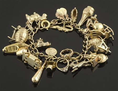 Bracciale "Charms" in oro 14kt, perle, diamanti e avorio. gr. 64,5.