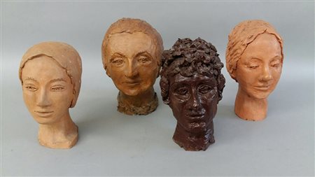 Magnaghi Matilde Gruppo di quattro sculture in terracotta raffiguranti teste...