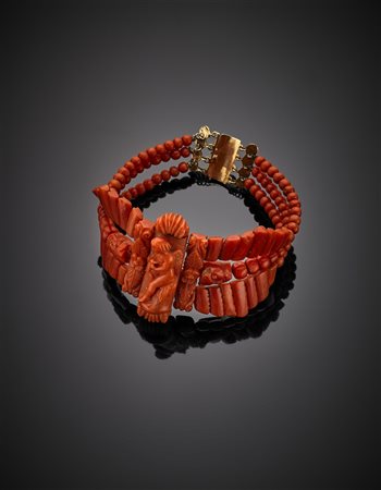 Bracciale scolpito in corallo rosso arancione con boules, mascheroni e...