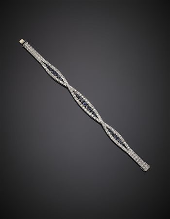 Bracciale con intreccio in oro bianco, diamanti e zaffiri, g 32,82, lungh. cm...