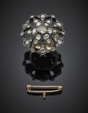 Broche a guisa di stella trasformabile in anello in oro giallo, argento e...