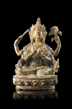 Bodhisattva dalle molte braccia in bronzo dorato, con numerosi oggetti...