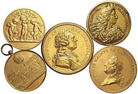 VARIE. 5 medaglie in bronzo dorato, una con foro interno, varie epoche.