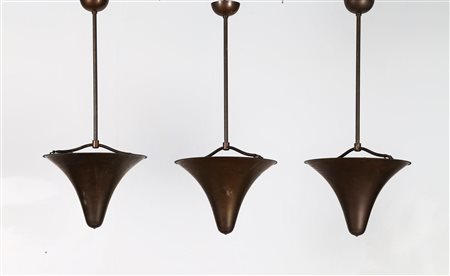 MANIFATTURA ITALIANA Tre lampade a sospensione in ferro operato e ottone,...