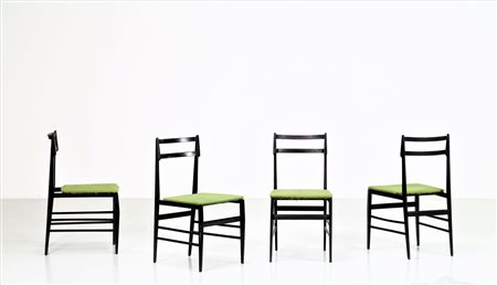 MANIFATTURA ITALIANA Quattro sedie in legno ebanizzato e tessuto, anni 60. -....