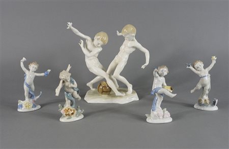 Lotto di 5 statuine in porcellana policroma tra cui putti. H. max cm. 22.