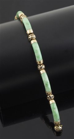 Bracciale semirigido composto da segmenti in pietra dura verde congiunti da...