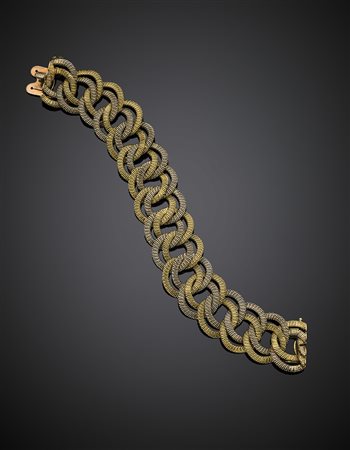 Bracciale a catena zigrinata in oro bianco e giallo, g 84,41, lungh. cm 20...