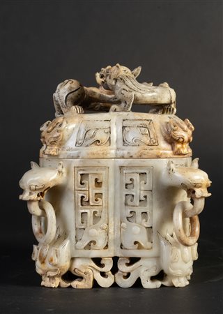 Arte Cinese  A white jade and russet container carved with archaic style animals in relief China, 19th century .