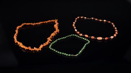Arte Cinese  Three necklaces made of amber, jade and carnelian .