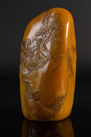 Arte Cinese  A soapstone carving with characters at sunset China, 20th century .