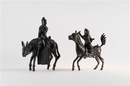 Arte Cinese  Two cast dark bronze figures depicting characters riding a horseChina, Qing dinasty, 19th century .