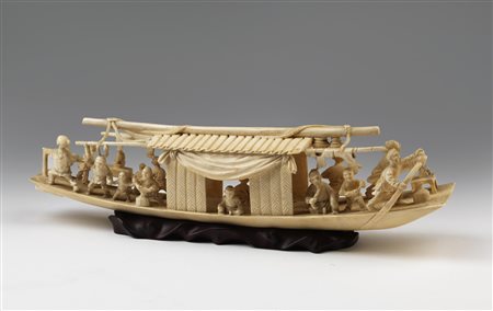 ARTE GIAPPONESE  An ivory carving depicting a boat with characters Japan, early 20th century .