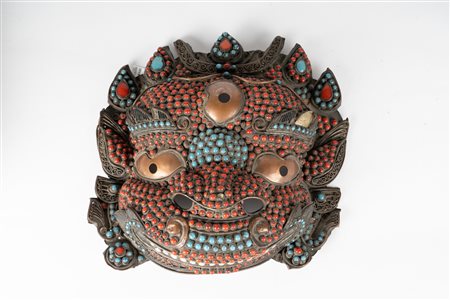 Arte Himalayana  A coral and turquoise incrusted mask Tibet, 20th century .