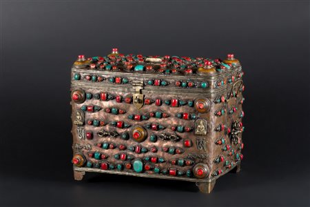 Arte Himalayana  An embossed metal box encrusted with turquoise, amber, madrepore and coralsTibet, early 20th century .