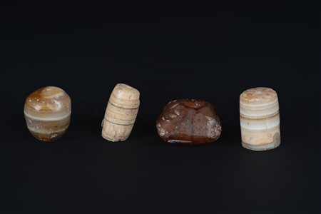Arte Himalayana  A group of four agate and carnelian beads Afghanistan, Bactriana, 3rd century b.C.