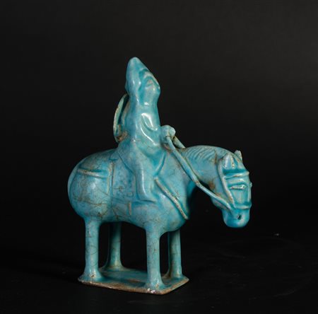 Arte Islamica  A possibly Seljuk Kashan turquoise glazed pottery figure of a rider Iran, 12th-13th century or later  .