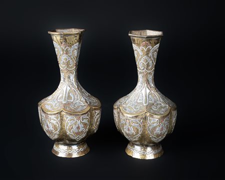 Arte Islamica  A pair of Cairoware bottles with silver and copper inlays Egypt, 19th century .