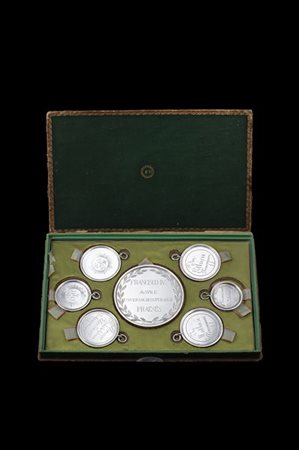 Serie di sette medaglie premio in argento contenute in custodia, donate da Fran