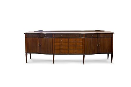 CREDENZA Credenza di gusto inglese in palissandro, epoca XX secolo; fronte...