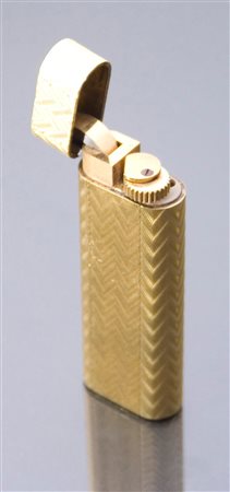 CARTIER Accendino, firmato "Cartier", laminato in oro giallo