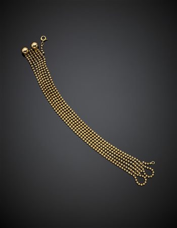 CARTIER
Bracciale in oro giallo "Draperie" a sei fili di piccole boules, g 28,6