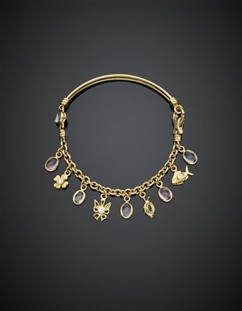 CARETTA
Bracciale a maglia in parte rigido in oro giallo con charms in gemme si