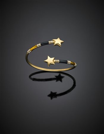 Bracciale rigido a contrariè in oro giallo e bianco terminato da due stelle e r