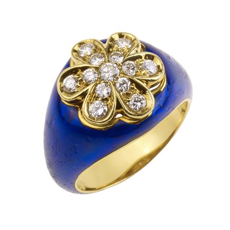 ANELLO IN ORO GIALLO, DIAMANTI E SMALTO BLU al centro una corolla in diamanti...