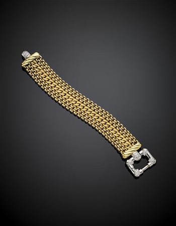 Bracciale in oro giallo e bianco a fascia con pietre incolori, g 66,50 circa, l