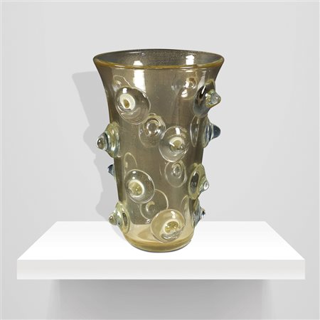 Tommaso BarbiMurano, anni 7038x25,5 cm.vaso bugnato in vetro trasparente con...