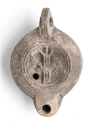 Roman Oil Lamp with Rudder and Fishes, 1st - 2nd century AD; height cm 4,5, length cm 11