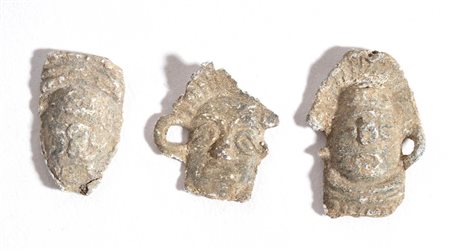 Group of Three Roman Lead Toys, Masks, 1st - 4th century AD; length max cm 2