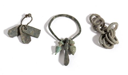 Group of Three Mostly Roman Bronze Decorative Elements, From 1st century BC; length max cm 4