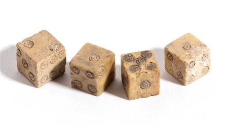 Group of Four Roman Bone Gaming Dices, 1st - 3rd century AD; length max cm 0,4