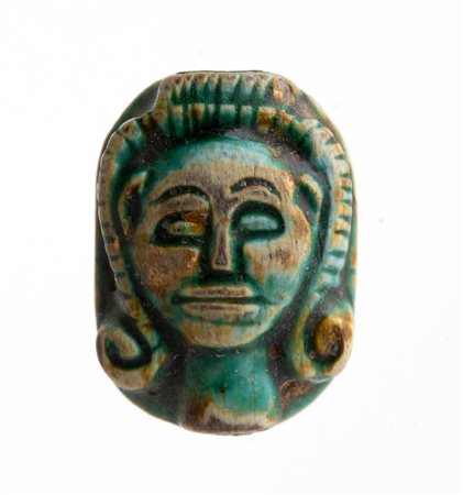 Egyptian Faience Scaraboid Amulet in the Shape of Hator head, Late Period, 664 - 332 BC; length cm 1,5.