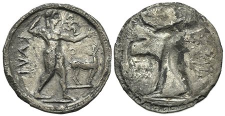 Bruttium, Kaulonia, Stater, ca. 525-500 BC; AR (g 7.69; mm 29; h 12); KAVL (retrograde), Apollo advancing r., holding branch; small daimon running r. on Apollo's l. arm; to r., stag standing r., head reverted. R/ Incuse of obverse