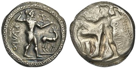 Bruttium, Kaulonia, Stater, ca. 500-480 BC; AR (g 7,83; mm 26; h 12); KAVLO (retrograde), Apollo advancing r., holding branch; small daimon running r. on Apollo's left arm; to r., stag standing r., head reverted; Rv. Incuse of obv