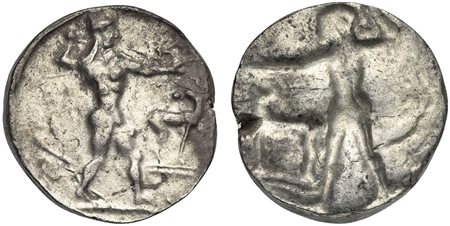Bruttium, Kaulonia, Stater, ca. 475-470 BC; AR (g 8,12; mm 21; h 12); Apollo advancing r., holding branch; small daimon running r. on Apollo's l. arm; to r., stag standing r., head reverted; Rv. Incuse of obverse, but no daimon an