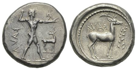 Bruttium, Kaulonia, Stater, ca. 475-425 BC. AR (g 7.89, mm 20, h 3). KAVΛ (retrograde), Nude Apollo walking r., holding branch, holding small running daimon on outstretched arm; before, stag standing r., head turned back; KAVΛ (re