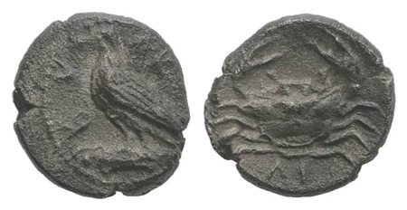 Sicily, Akragas, Litra, ca. 450-440 BC; AR (g 0.59, mm 7; h 12). Eagle standing l. on capital; Rv. Crab; ΛI below. Westermark, Coinage, 467; SNG ANS 989–995; HGC 2, 121. Cabinet tone, near extremely fine