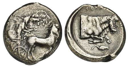 Sicily, Gela, Tetradrachm, ca. 430-425 BC. AR (g 17,17; mm 25; h 12). Charioteer driving walking quadriga r., holding kentron and reins; above, wreath, Rv. CEΛΑΣ, forepart of man-headed bull r.; below heron; all within incuse circ