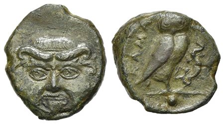 Sicily, Kamarina, Onkia, ca. 420-405 BC. AE (g 1,63; mm 12; h 9). Facing gorgoneion; Rv. KAMA, Owl standing r., head facing, grasping lizard in talons. CNS 2; SNG ANS -; HGC 2, 552. Green patina, very fine