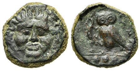 Sicily, Kamarina, Tetras, ca. 420-405 BC. AE (g 3,61; mm 15; h 12). Facing gorgoneion; Rv. KAMA, Owl standing l., holding lizard. CNS 20; SNG ANS 1226; HGC 2, 547. Very fine